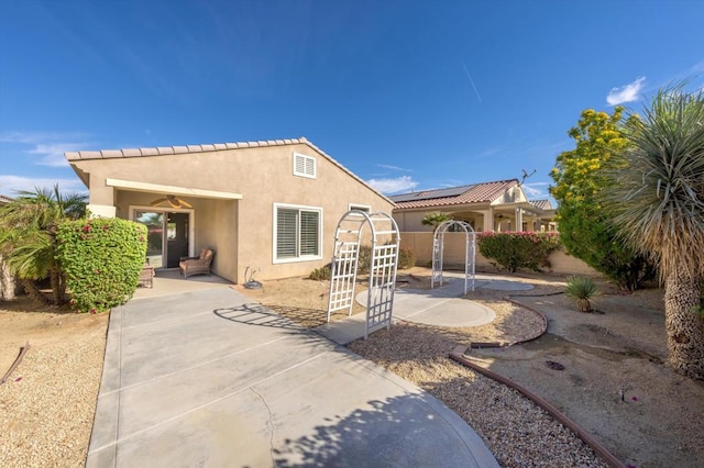 rear view of house with a patio