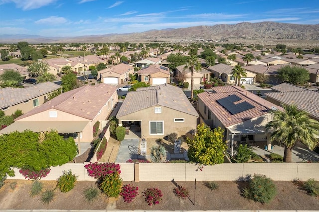 birds eye view of property featuring a mountain view