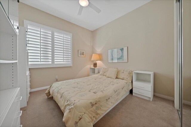 carpeted bedroom featuring ceiling fan