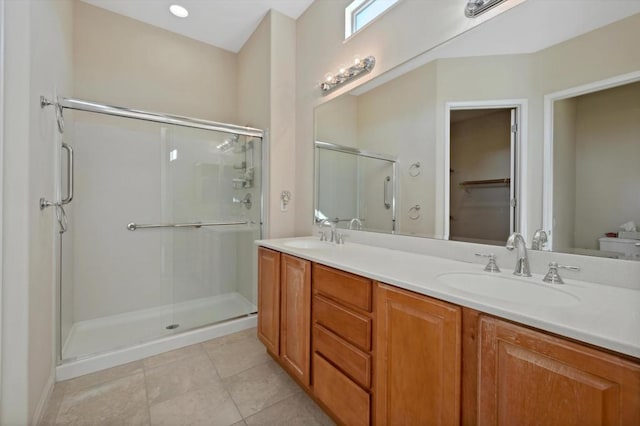 bathroom featuring vanity, a shower with shower door, toilet, and tile patterned flooring