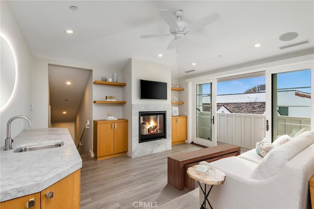 738 Cliff Dr, Laguna Beach, CA 92651 - living room with light wood-style floors, a glass covered fireplace, a ceiling fan, and recessed lighting