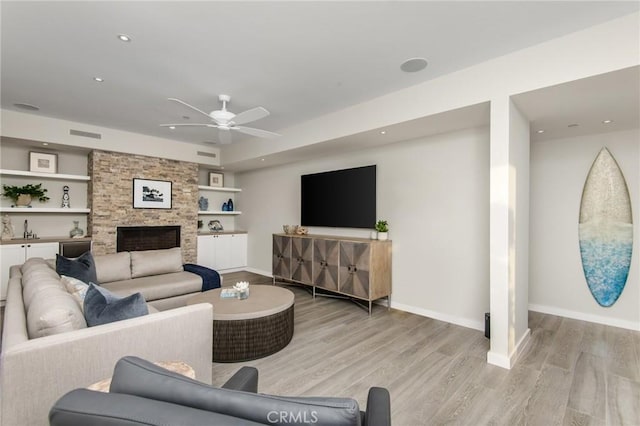 738 Cliff Dr, Laguna Beach, CA 92651 - living room featuring light wood-style floors, a ceiling fan, baseboards, built in shelves, and recessed lighting