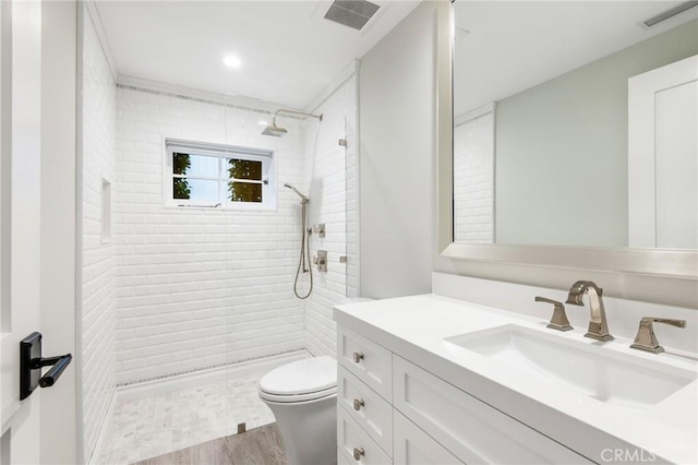 738 Cliff Dr, Laguna Beach, CA 92651 - bathroom featuring toilet, vanity, tiled shower, and wood finished floors