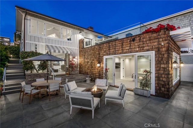 738 Cliff Dr, Laguna Beach, CA 92651 - view of patio / terrace with a fire pit, stairs, and outdoor dining area