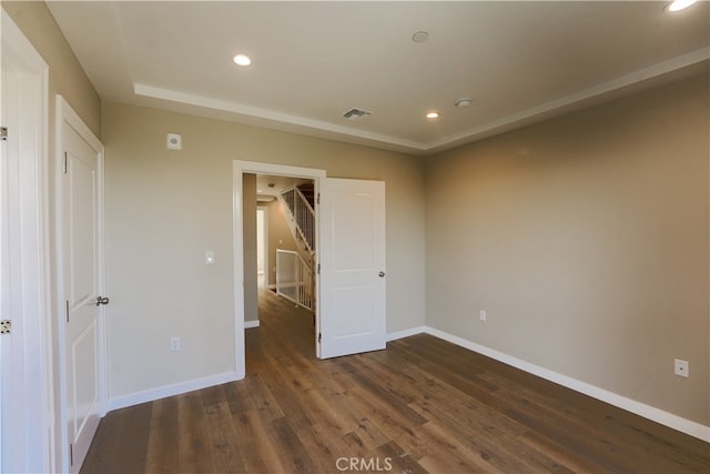 unfurnished bedroom featuring dark wood-type flooring