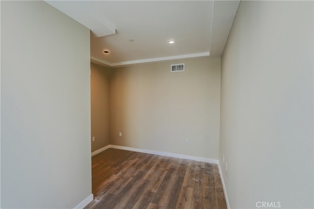 unfurnished room featuring dark hardwood / wood-style flooring