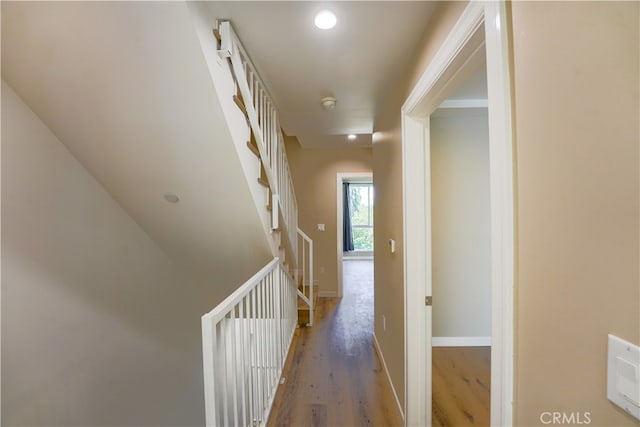 corridor featuring wood-type flooring