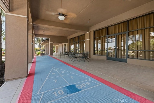 view of home's community featuring shuffleboard