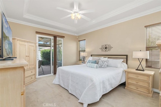 bedroom with access to outside, a tray ceiling, crown molding, light colored carpet, and ceiling fan