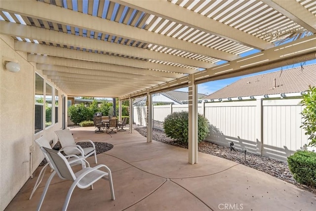 view of patio / terrace with outdoor dining space, a pergola, and a fenced backyard