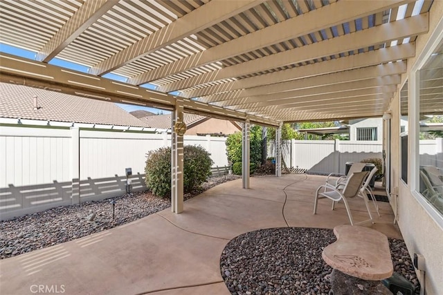 view of patio / terrace with a fenced backyard and a pergola