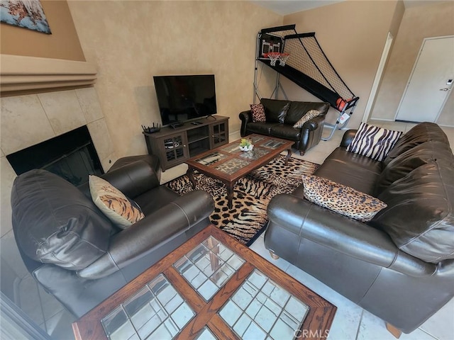 living room featuring a tile fireplace