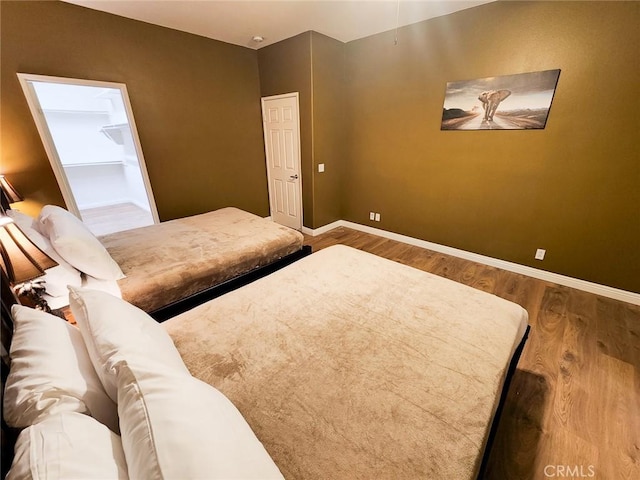 bedroom with wood-type flooring