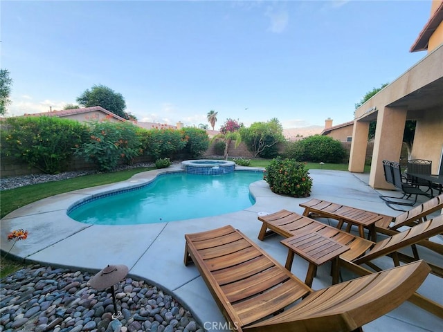 view of pool with an in ground hot tub and a patio area