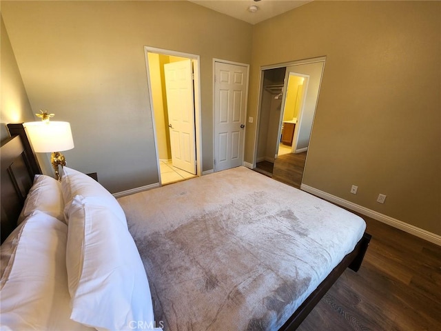 bedroom with dark wood-type flooring