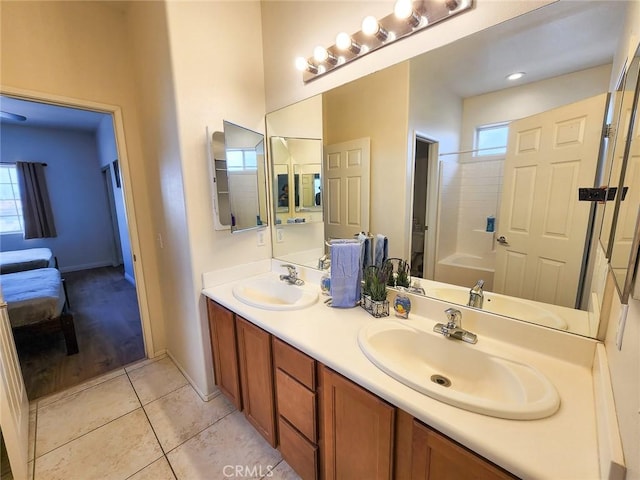 bathroom featuring shower / bathtub combination, tile patterned floors, and vanity