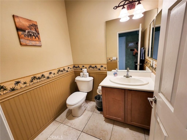 bathroom with vanity, a notable chandelier, tile patterned flooring, and toilet