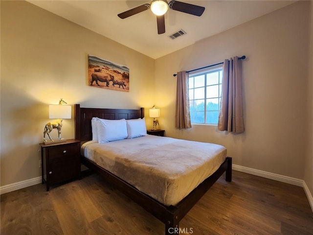 bedroom featuring ceiling fan and dark hardwood / wood-style floors