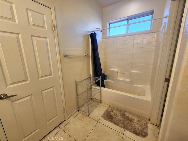 bathroom featuring tile patterned flooring and shower / bath combo