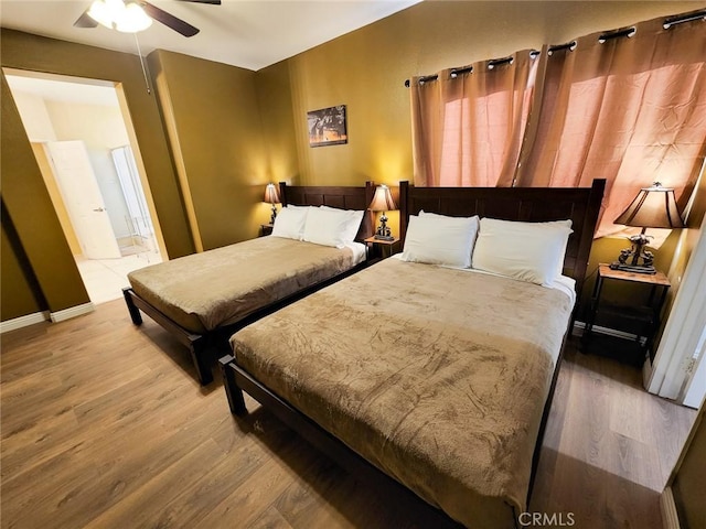 bedroom featuring hardwood / wood-style flooring and ceiling fan