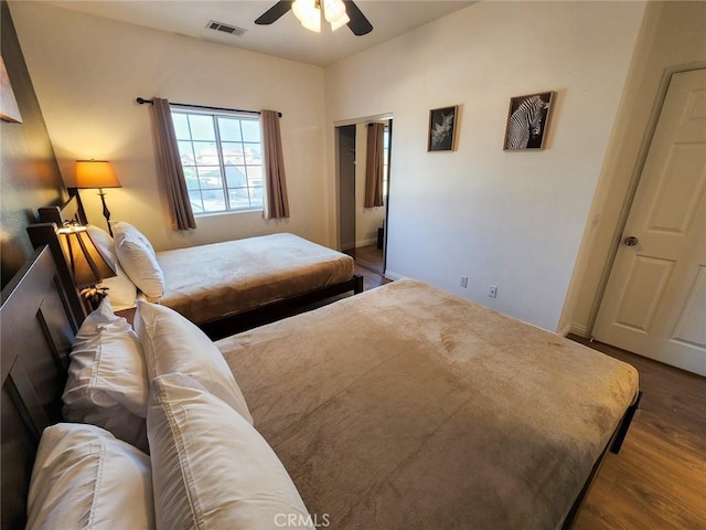 bedroom featuring dark wood-type flooring and ceiling fan