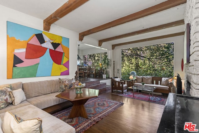 living room with beamed ceiling and hardwood / wood-style flooring