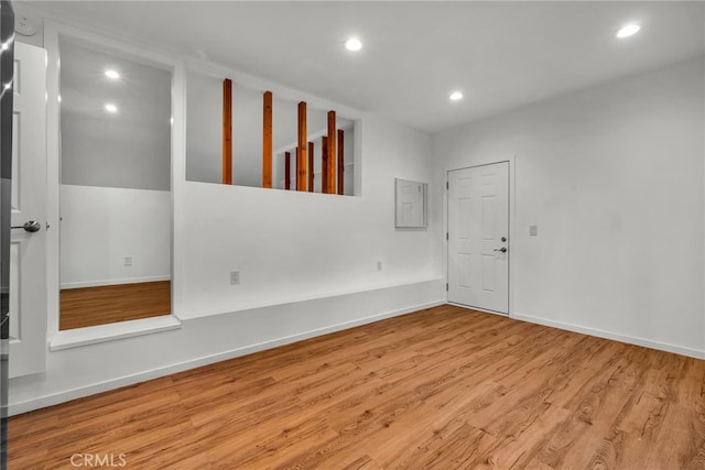 spare room with light hardwood / wood-style flooring