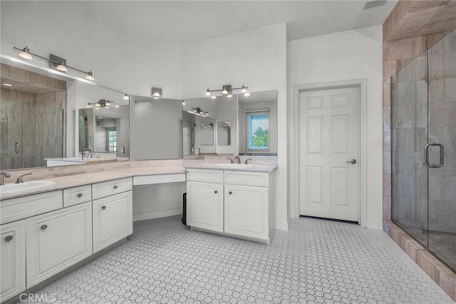 bathroom with vanity and an enclosed shower