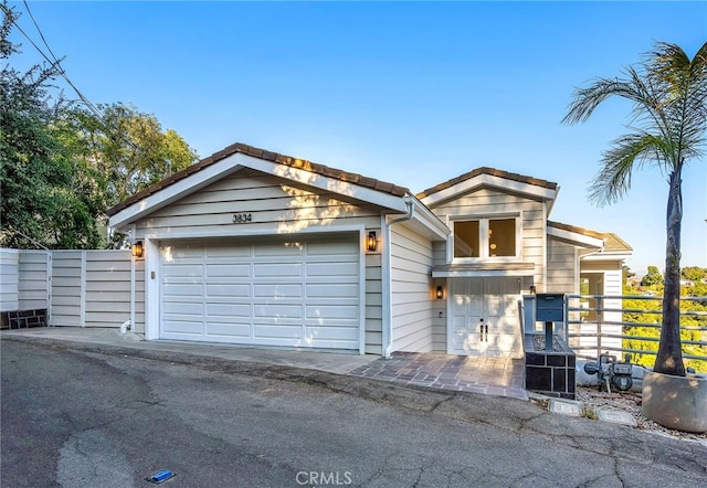 view of front of property featuring a garage