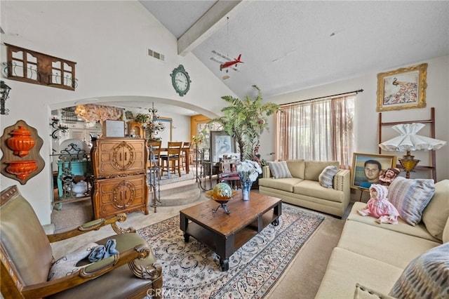 carpeted living room featuring a textured ceiling, beam ceiling, and high vaulted ceiling