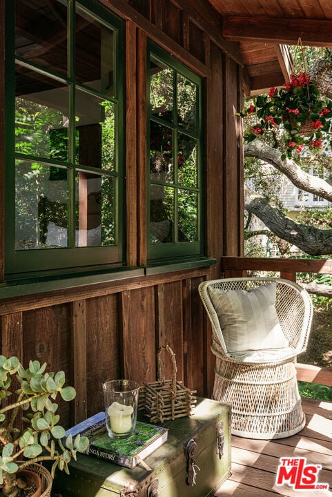 sunroom featuring wood ceiling