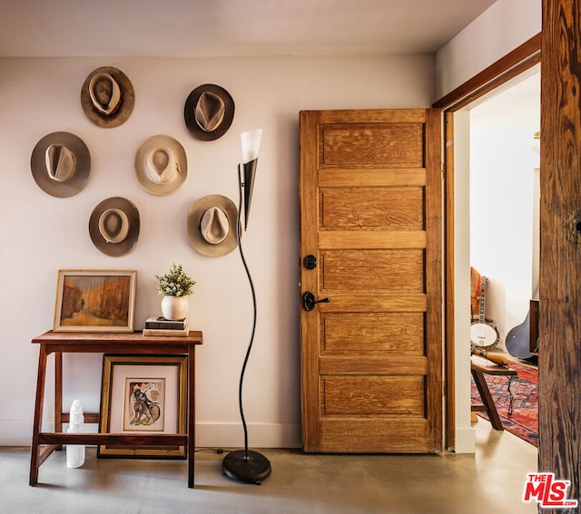 foyer entrance with concrete flooring