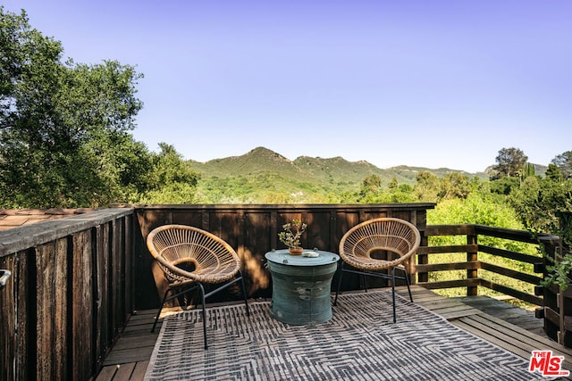 balcony with a deck with mountain view