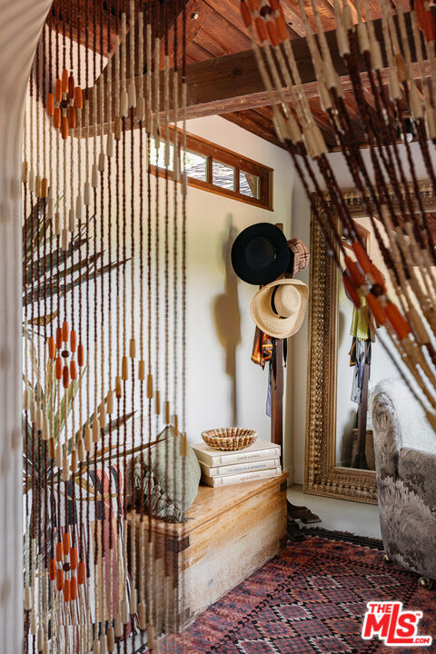 interior space featuring beam ceiling