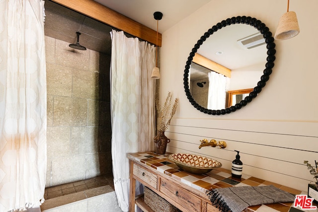 bathroom with vanity and walk in shower