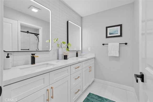 bathroom featuring vanity, tile patterned floors, and walk in shower