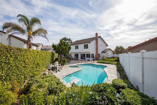 view of swimming pool with a patio