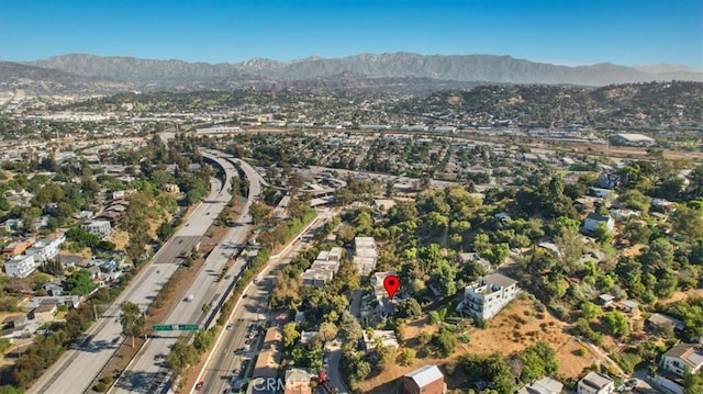 birds eye view of property featuring a mountain view
