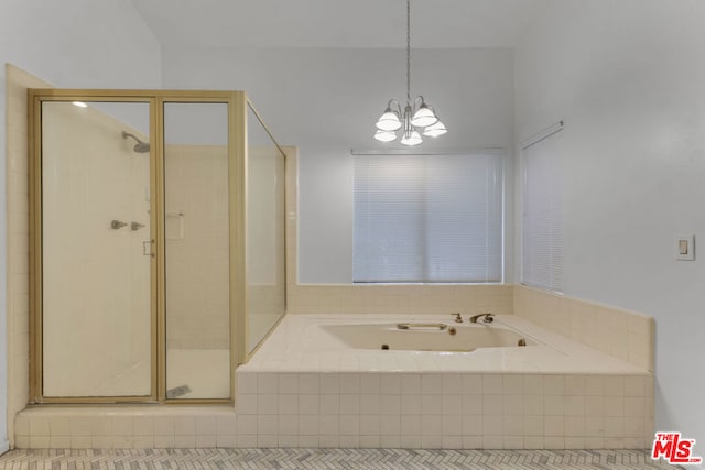 bathroom with independent shower and bath and a chandelier