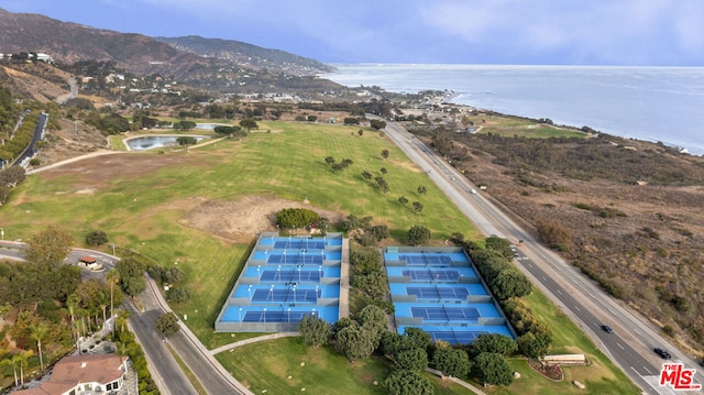 drone / aerial view with a water and mountain view