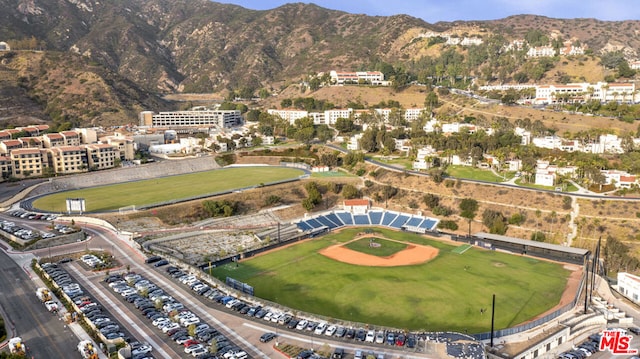 birds eye view of property featuring a mountain view