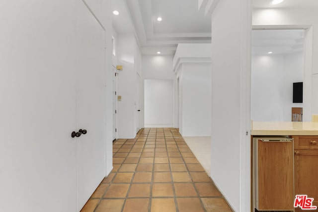 hall featuring light tile patterned flooring