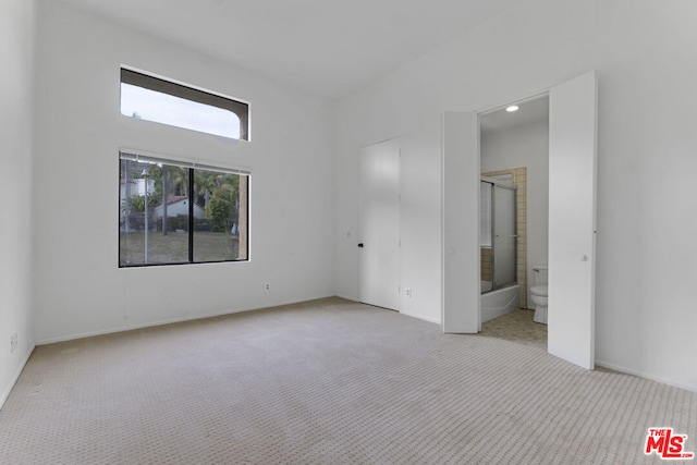 empty room featuring light colored carpet