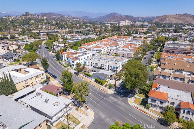 birds eye view of property with a mountain view