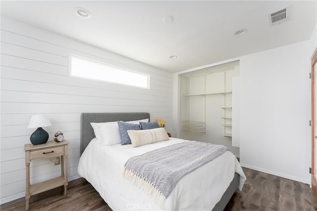 bedroom featuring dark wood-type flooring