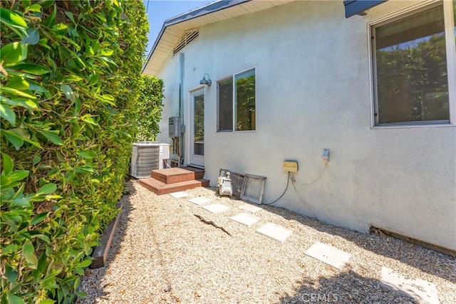 view of side of home featuring central air condition unit