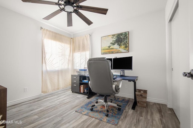 office with ceiling fan and light wood-type flooring