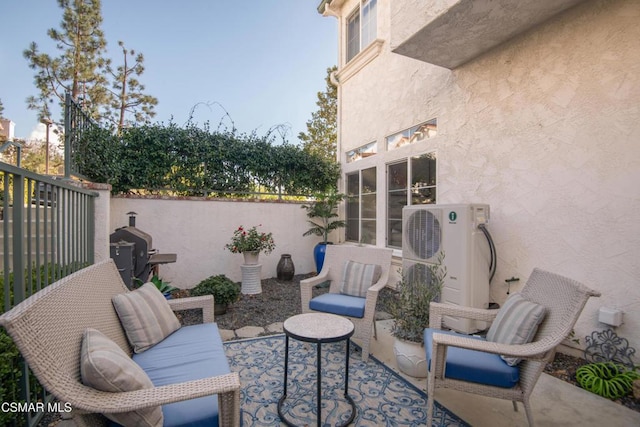 view of patio / terrace featuring grilling area and ac unit