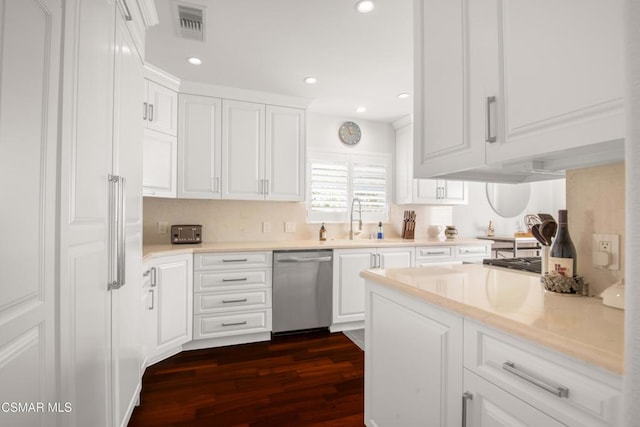 kitchen with white cabinets, dark hardwood / wood-style flooring, stainless steel dishwasher, and sink