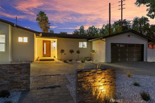 ranch-style home with a garage